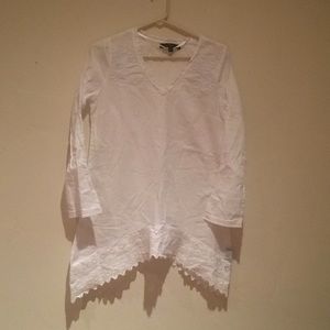 100% White cotton shirt.